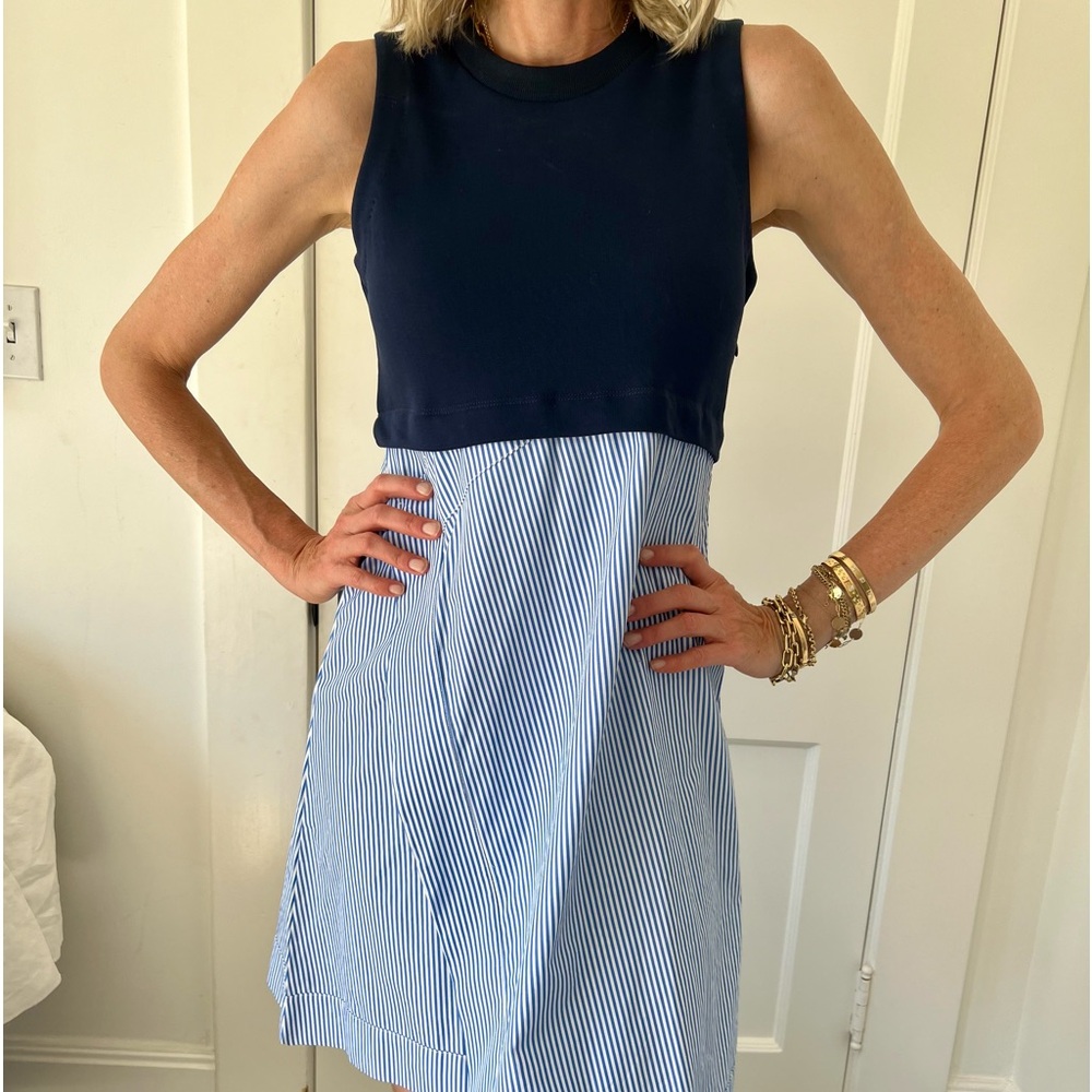 Chic Carvin asymmetrical dress. Navy on top and striped fabrics on bottom.
